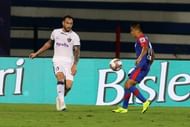 Eli Sabia (left) contains Sunil Chhetri
